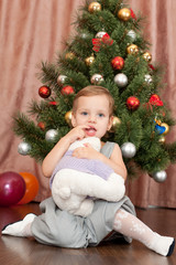 Cheerful girl with her christmas present