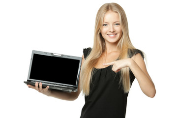 Pretty business woman pointing at laptop screen