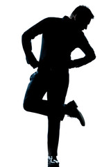 silhouette man full length looking at his shoes