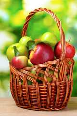 Healthy ripe apples in the bascet outdoors