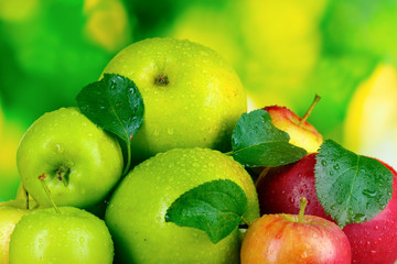 Fresh organic apples on wooden table isolated on white