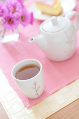 Cup of green tea pouring close up shoot