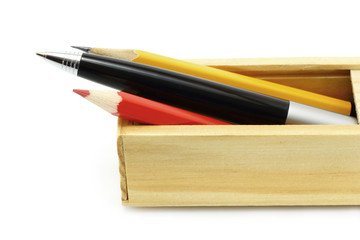 Obraz premium Pen and pencils in the box on a white background