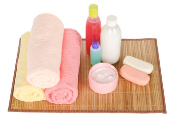 Obraz na płótnie Canvas Pink gerbera and a towel