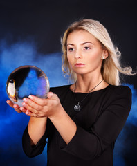 Young woman with crystal ball.