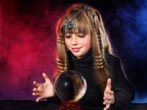 Child  holding crystal ball.