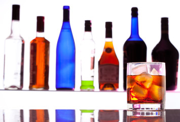 Alcohol drink with bottles on the background