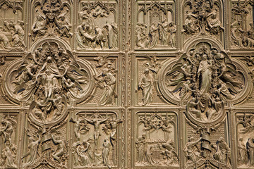 Milan - detail from main bronze gate of Duomo cathedral