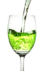 Green cocktail on a glass on white background