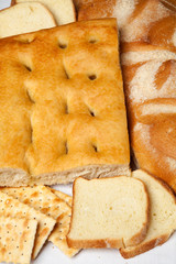 Closeup of genoese focaccia, bread and crackers.