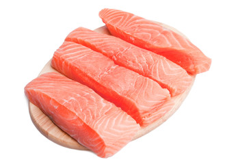 Five slice of fresh salmon on cutting board