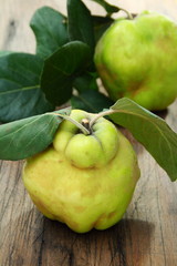 Ripe quince is on the table.