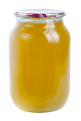 honey in glass jar isolated
