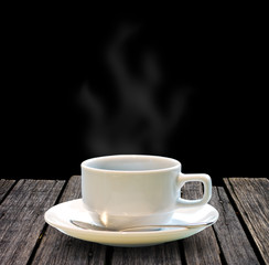 Hot coffee on wooden table