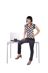 Fototapeta na wymiar Sexy Woman Sitting on the Desk