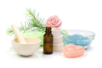 Bottle of fir tree essential oil and spa salt tablets