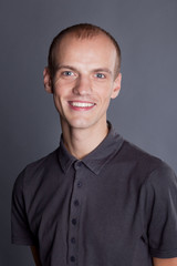 Closeup portrait of a young smiling guy