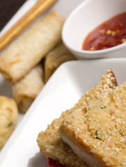 Chinese starters with a chilli sauce dip.