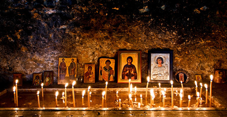 Burning candles and religious icons