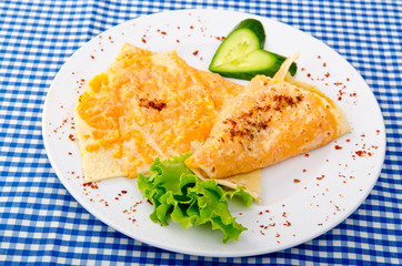 Pancake with pumpkin in plate