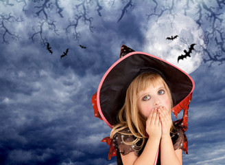 Halloween scared kid girl on dark moon sky