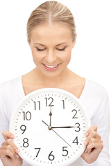 woman holding big clock