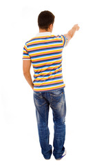 Fototapeta premium Young casual man pointing against white background