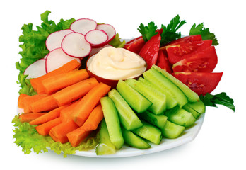 Chopped vegetables and sauce on plate isolated on white