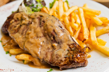 juicy steak beef meat with tomato and french fries