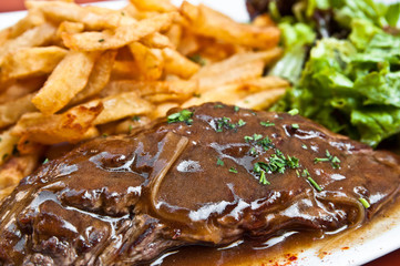 juicy steak beef meat with tomato and french fries