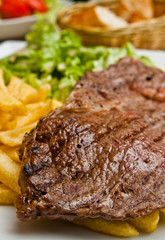 juicy steak beef meat with tomato and french fries