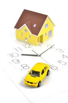 Model house,toy car and clock face