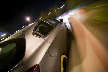 Selbstklebende Fototapeten Auto fährt schnell © Marc Xavier