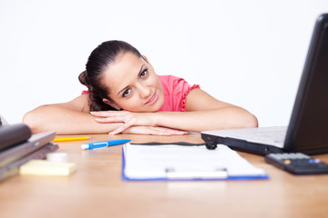 Portrait of relaxed young business woman smiling at office