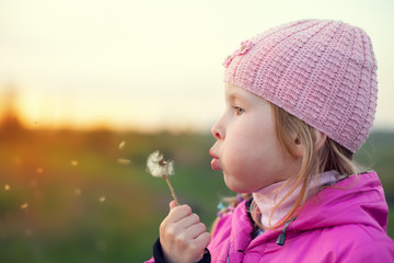 little girl with dandelion