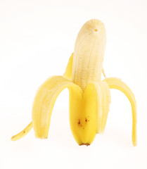 Obraz premium Peeled banana on white background.