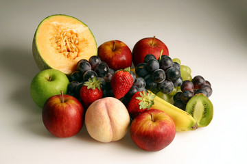 Naklejka na ściany i meble Delicious fresh ripe fruits on a gradient white background
