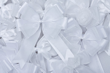 Stack of white fabric bow