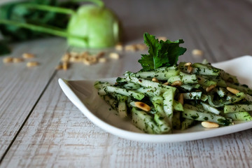Kohlrabi salad on a wooden table