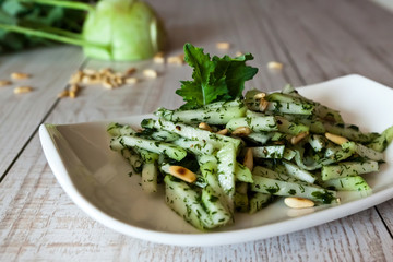 Kohlrabi salad on a wooden table