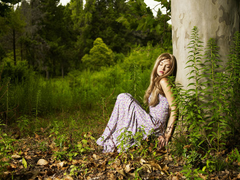 Beautiful young lady in the forest