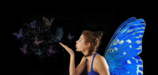 Fairy blowing butterflies