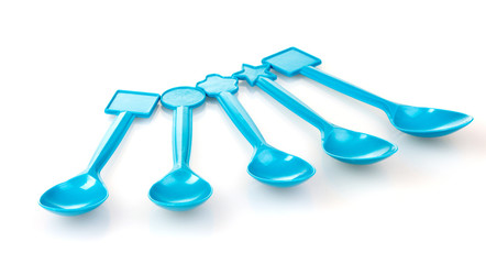 blue plastic spoons isolated on white