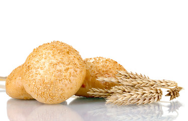 buns with sesame seeds and spikelets isolated on white