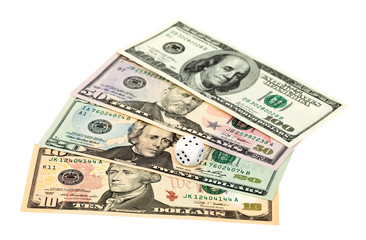 Dices on money background - business concept