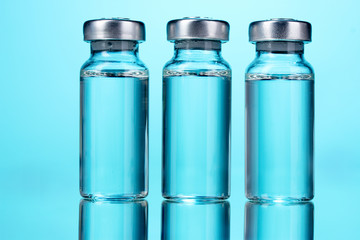 medical ampoules on blue background