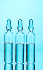 medical ampoules on blue background