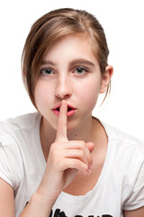 Portrait of young teen girl, gestures for silence