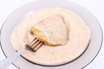 Soy Meat being prepared in breadcrumbs