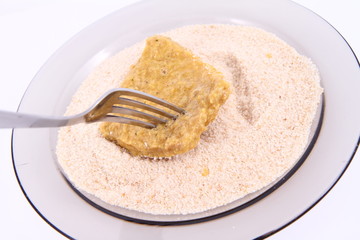 Soy Meat being prepared in breadcrumbs